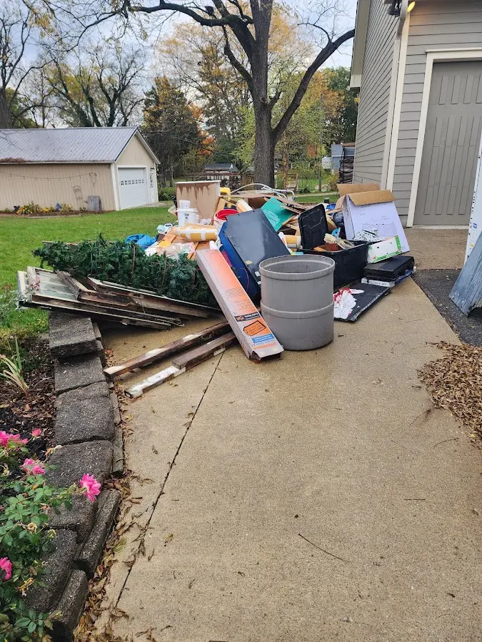 Dumpster being loaded with debris for 3 Yard Dumpster Rental in Tisbury